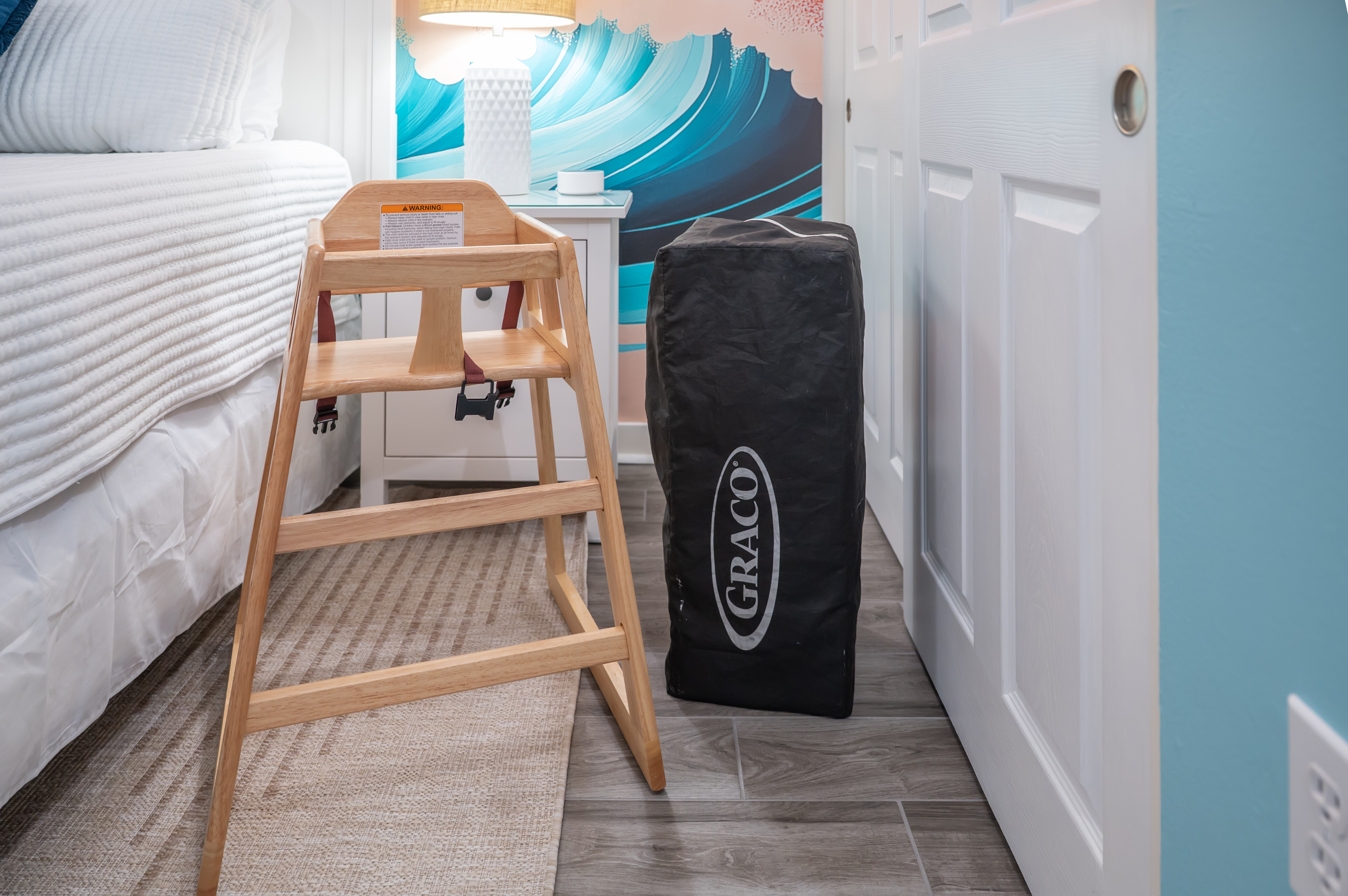 kids high chair and pack N play in unit